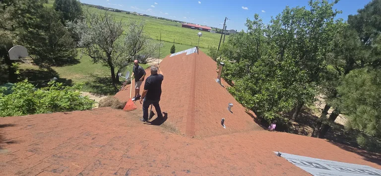 5 Star Roofing crew inspecting a residential shingle roof in Canyon, Texas — free hail damage assessment